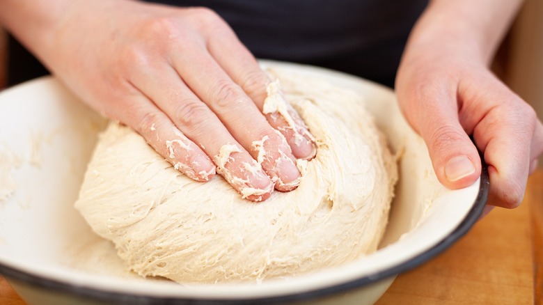 Kneading dough in bowl