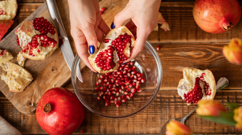 Taking seeds out of a pomegranate 