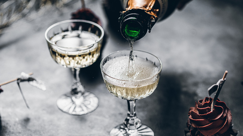 champagne being poured into glasses