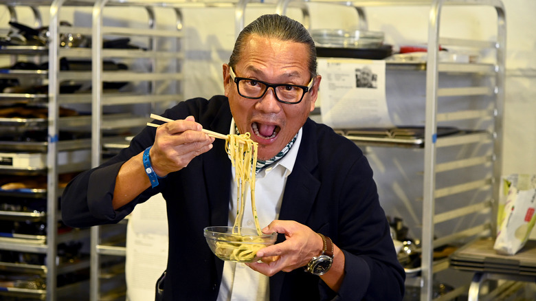 Masaharu Morimoto eating noodles