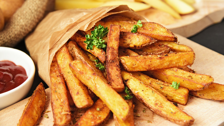 Seasoned fries in paper bag