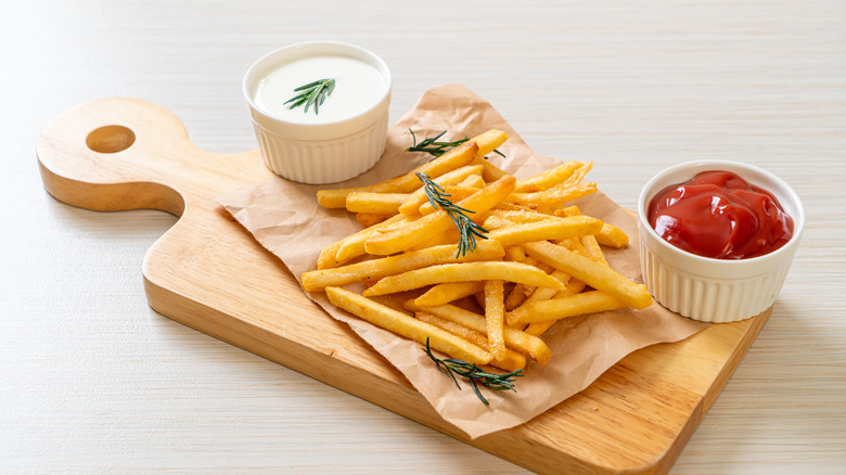 French fries with sour cream and ketchup