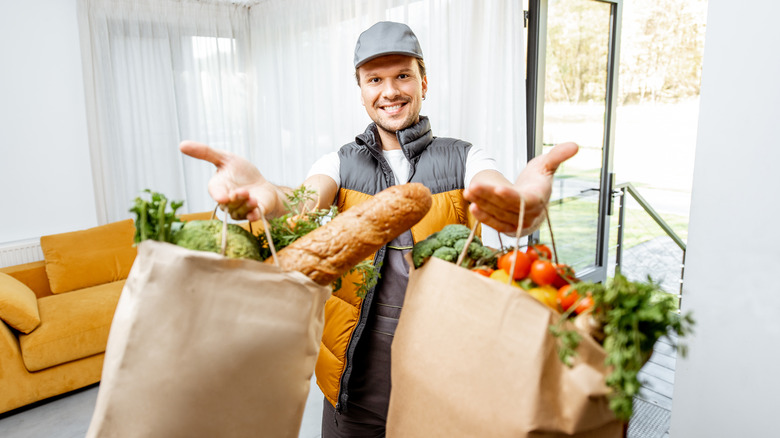 Courier delivering groceries