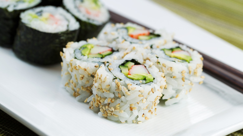 California rolls on a white plate.