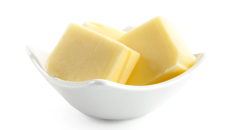 chunks of butter in white dish