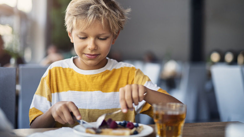 Child eating at restaurant 