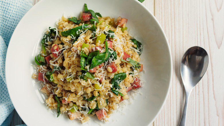 Barley salad on white plate