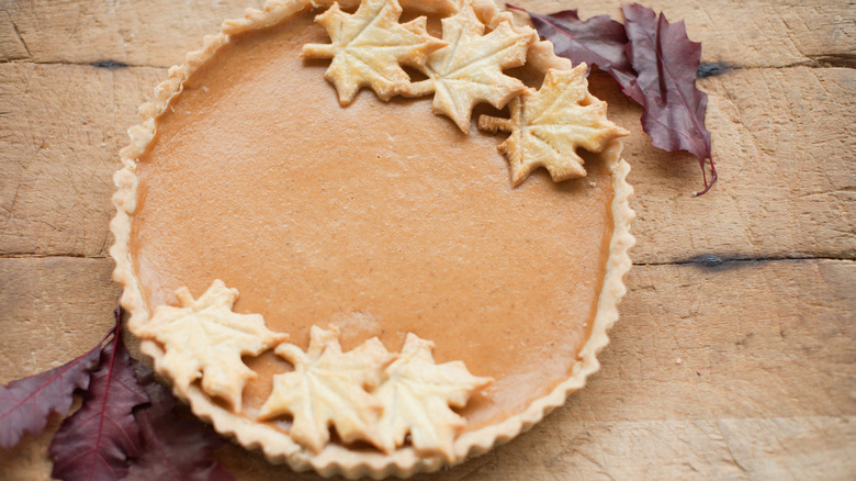 Pumpkin pie with maple leaves