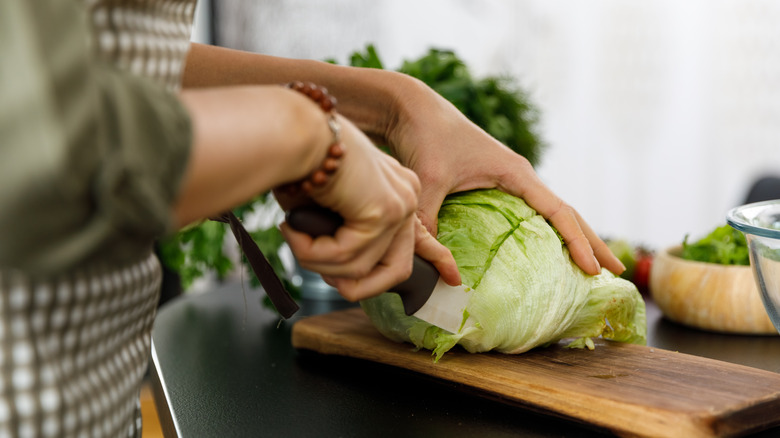 Cutting iceberg lettuce