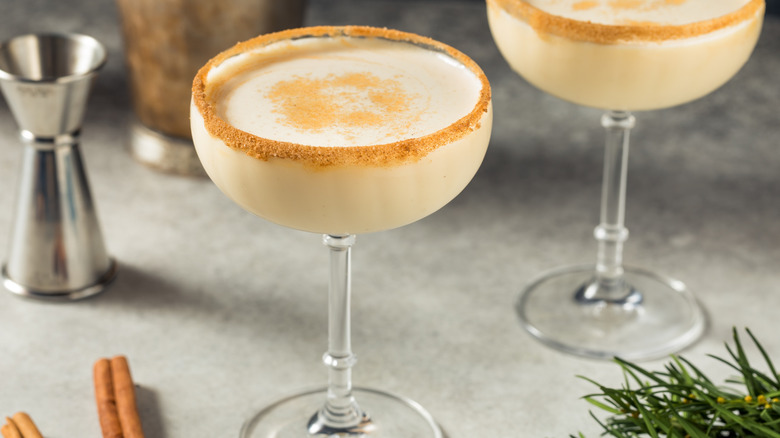 boozy eggnog in margarita glasses on a festive table