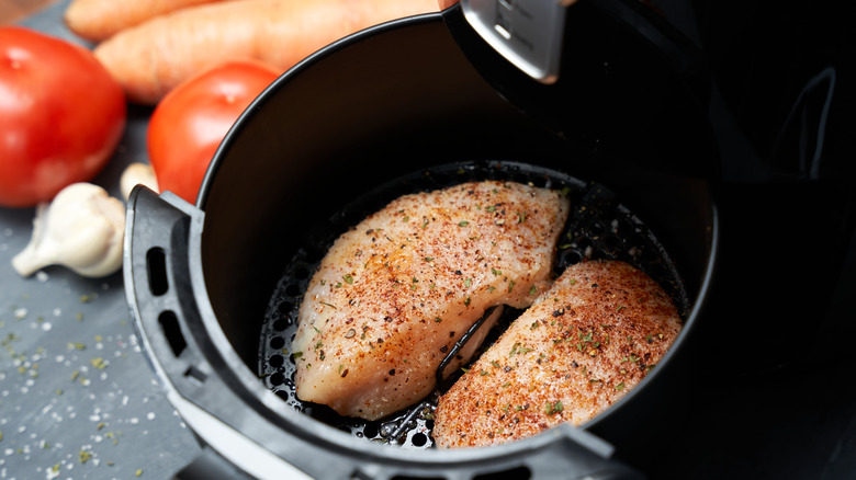 Chicken breast in air fryer basket