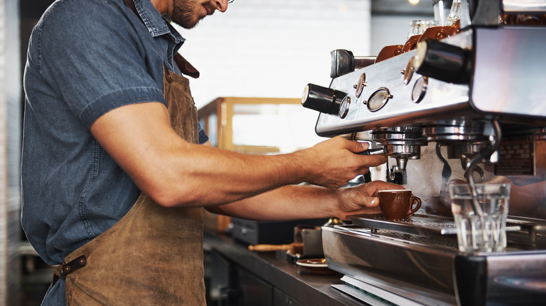 Barista at a machine