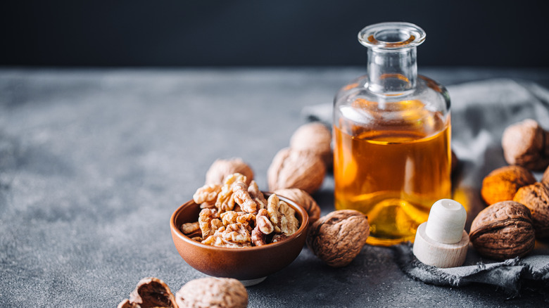 Walnuts with a bottle of oil