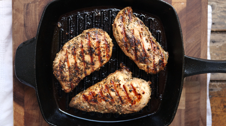 Cooking chicken breasts on pan