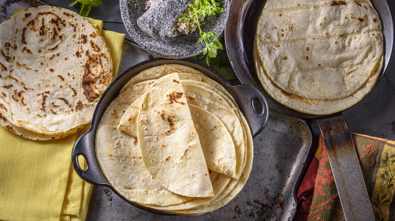 stack of tortillas in cast iron pan