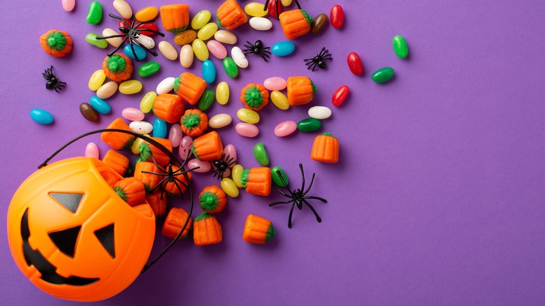 Trick-or-treat bowl spilling candy