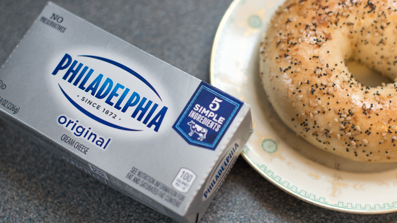 Philadelphia cream cheese and bagel on plate