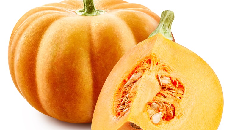 A full pumpkin and a slice of it