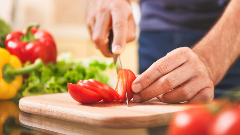 slicing tomatoes with a tomato knife