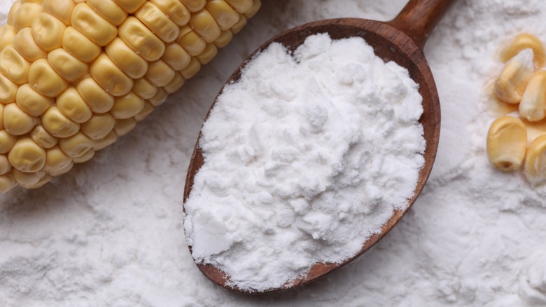 Cornstarch on spoon with whole corn