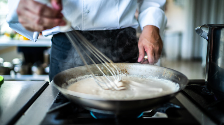 Chef making a cream sauce