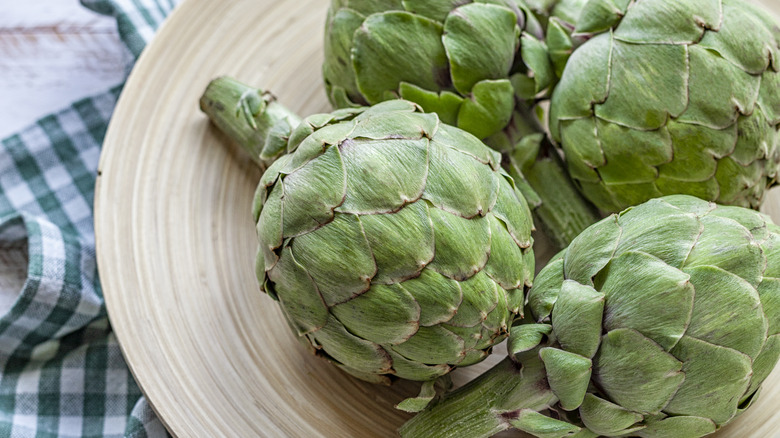 fresh artichokes on a plate