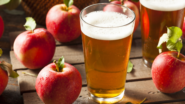 glasses of cider and apples