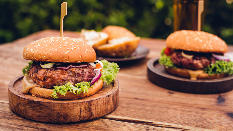 Grilled burgers on outside table