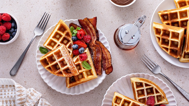 waffles with berries and bacon on plate