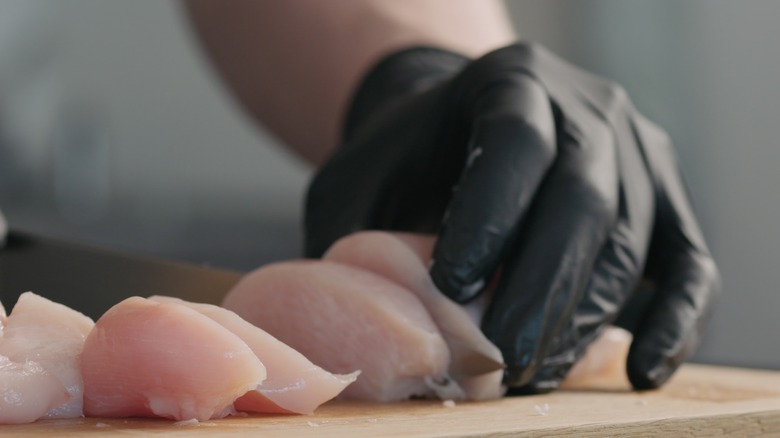 slicing raw chicken breast