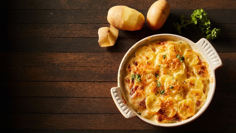 Potato gratin on a table in bowl