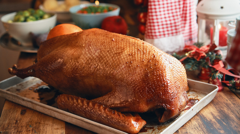 Holiday table with a roasted goose