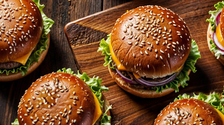 Overhead view of cheeseburgers on table