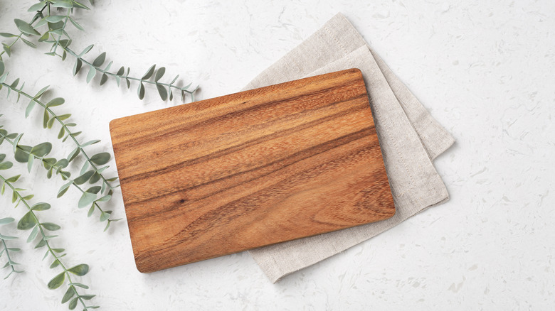 Cutting board with napkins underneath