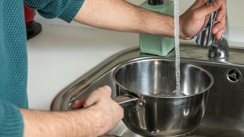 filling up a pot of water