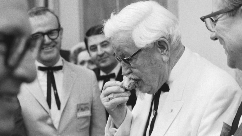 colonel sanders eating fried chicken