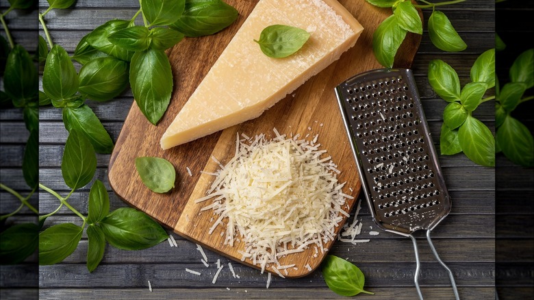 cheese grater on wood board