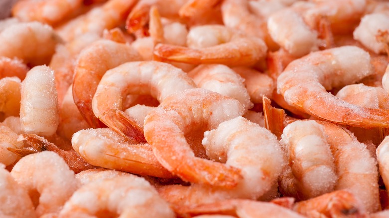 Frozen cooked shrimp in a pile