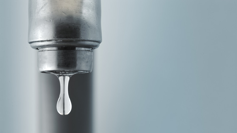 water droplet falling from faucet