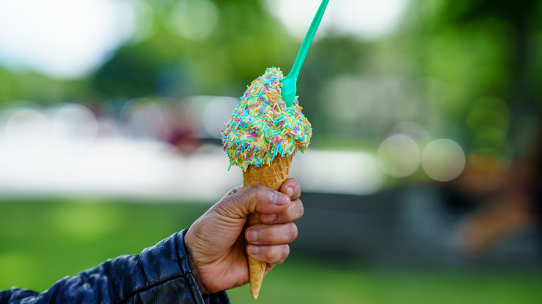 Swirled ice cream cone with sprinkles