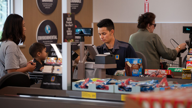 Aldi cashier checking out customer