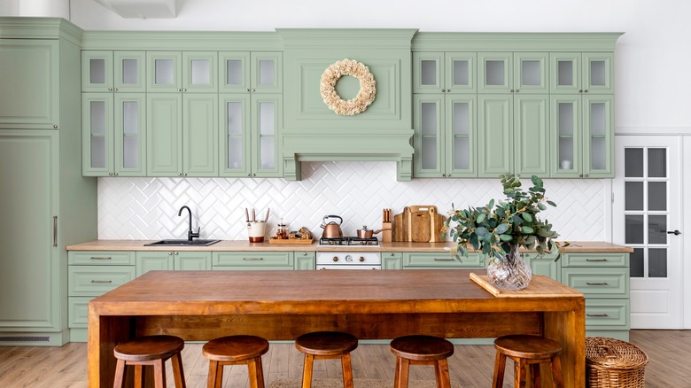 kitchen with green cabinetry