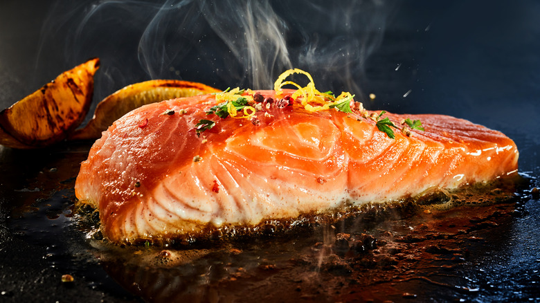 Salmon searing on a grill