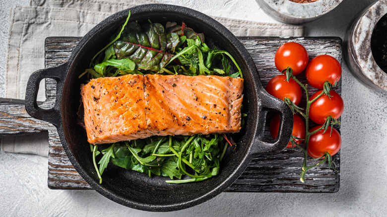 Salmon with tomatoes and greens