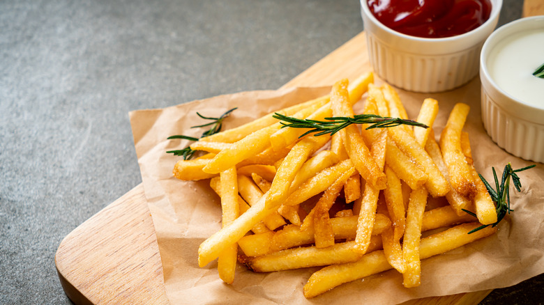 Fries with sour cream and ketchup