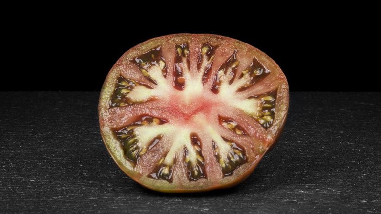 inside of a sliced Cherokee purple tomato