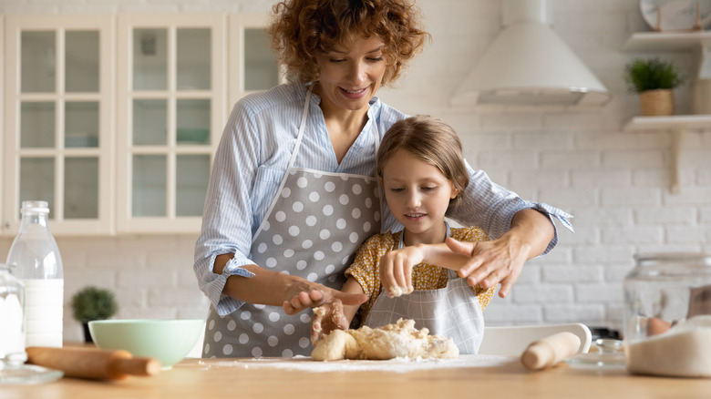 kneading dough in the kitchen