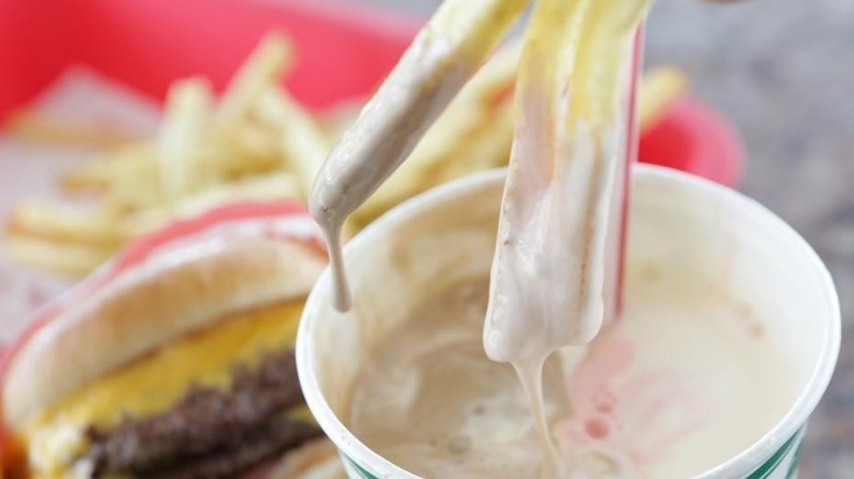 Fries dipped in a milkshake