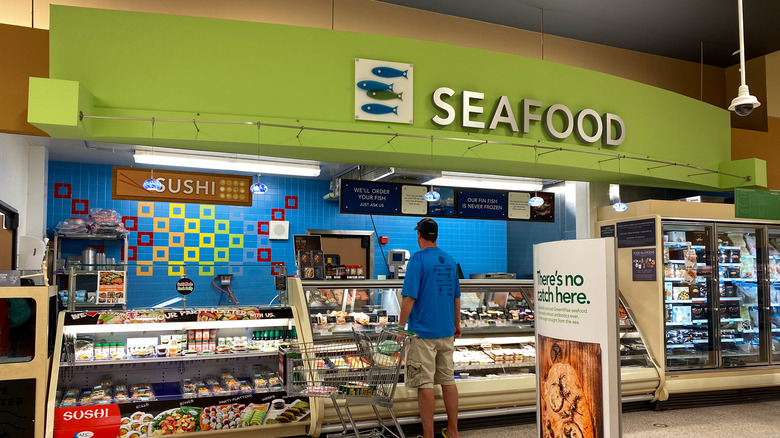 Man standing in Publix seafood department