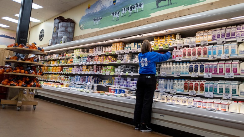 A Trader Joe's employee stocks the shelves